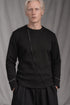 eigensinnig wien | Djadek | Extravaganter schwarzer Designer-Wollpullover mit avantgardistischer Silhouette