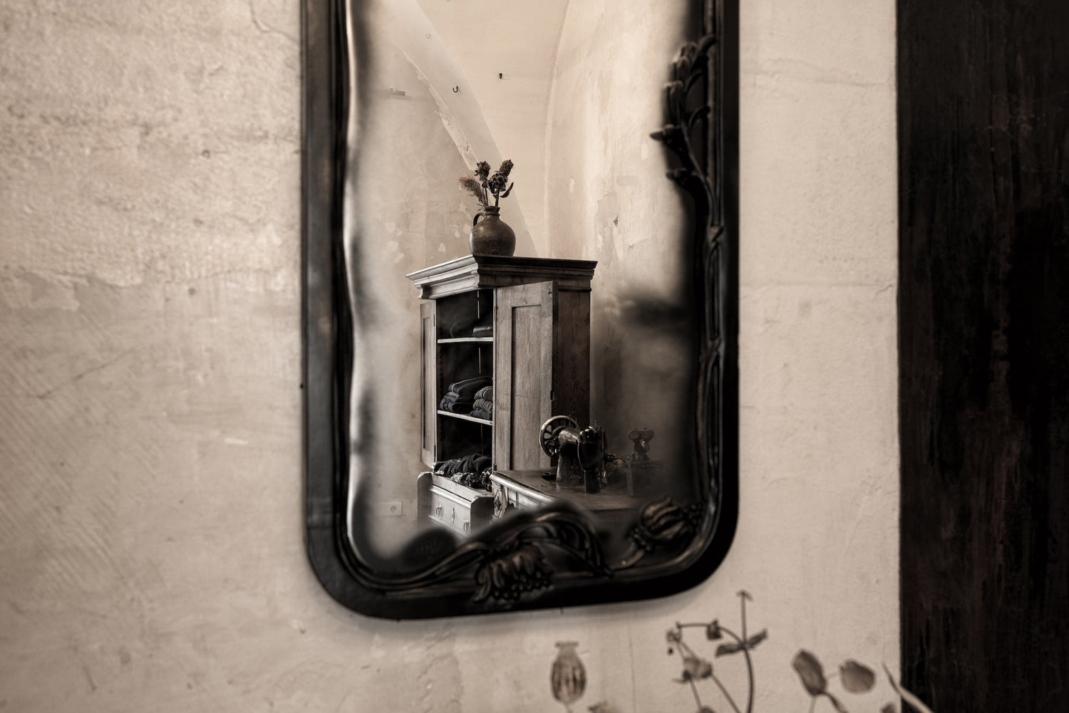 Mirror reflection in eigensinnig wien atelier. Focus on avant-garde fashion.