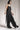 eigensinnig wien | Rilke | Eleganter Jumpsuit mit Haremshose aus Seide in Schwarz