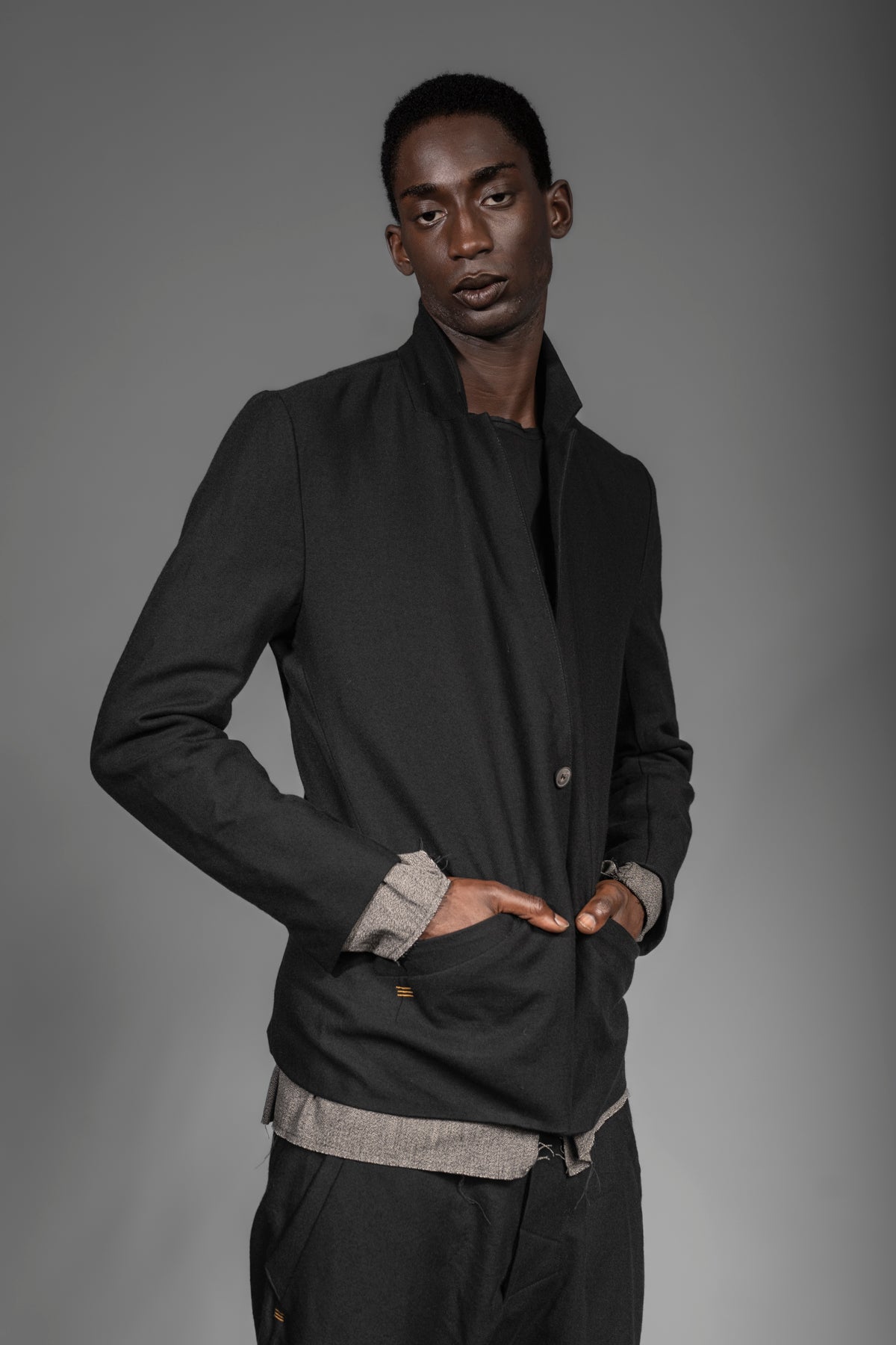 Avant-garde men's designer blazer-jacket from black wool